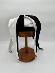 Jester hat side view showing fabric points and bell detail