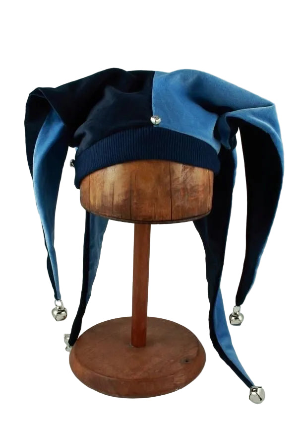 Blue and navy velvet jester hat with bells on wooden hat stand